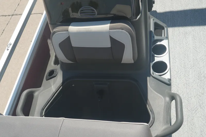 Slide: The Image of 2026 Sun Tracker Bass Buggy 18 DLX boat interior with seating and cup holders. - 8