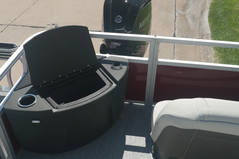 Slide: The Image of 2026 Sun Tracker Bass Buggy 18 DLX boat interior with seating and storage compartment. - 11
