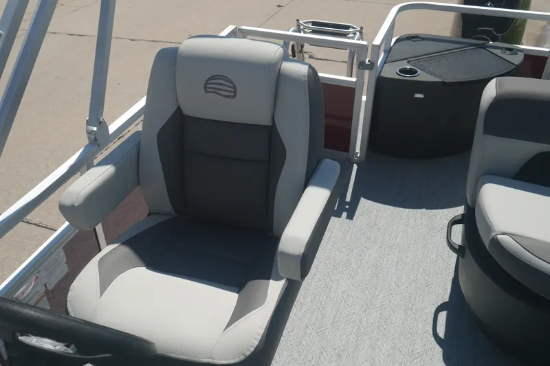Slide: The Image of 2026 Sun Tracker Bass Buggy 18 DLX boat seat with armrests and modern design. - 13