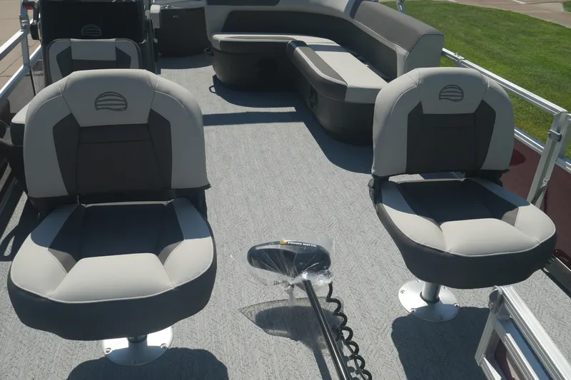 Slide: The Image of 2026 Sun Tracker Bass Buggy 18 DLX pontoon boat interior with comfortable seating. - 5