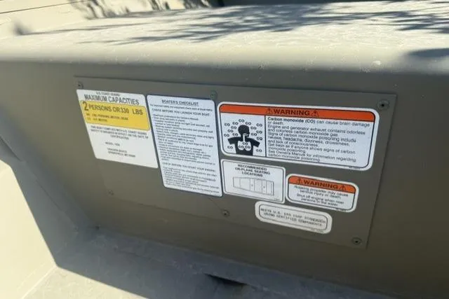 Slide: The Image of Safety and capacity labels on a 2026 Tracker Grizzly 10 Jon boat. - 4