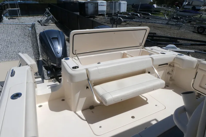 Slide: The Image of 2019 Grady-White Canyon 336 boat interior with seating and Yamaha outboard engine. - 3