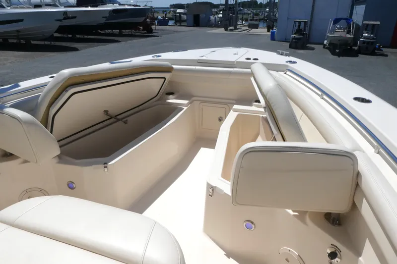 Slide: The Image of 2019 Grady-White Canyon 336 boat interior with open storage compartments and seating. - 8