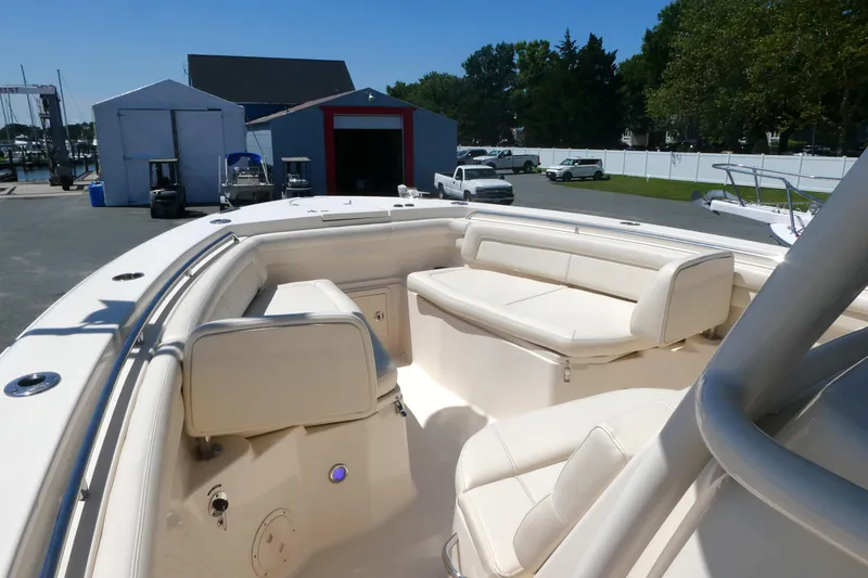 Slide: The Image of 2019 Grady-White Canyon 336 boat with spacious seating, docked at a marina. - 7