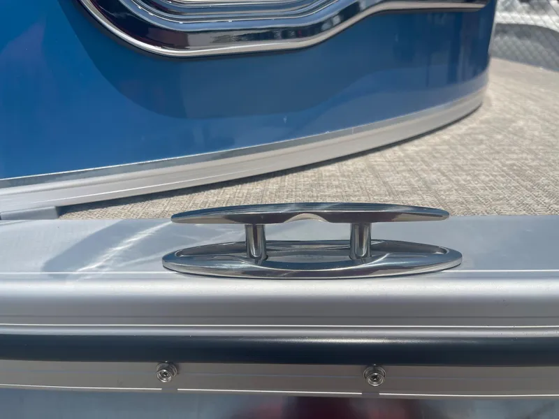 Slide: The Image of Close-up of a blue 2024 Avalon LSZ Rear Fish with a silver mooring cleat. - 40