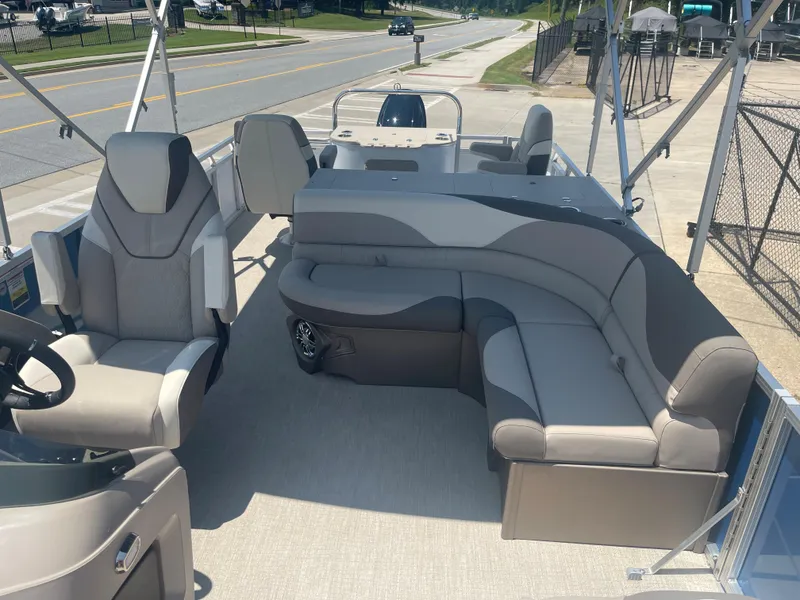 Slide: The Image of The image shows the interior of a 2024 Avalon LSZ Rear Fish pontoon boat with comfortable seating. - 14