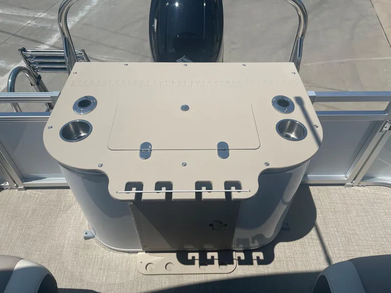 Slide: The Image of The image shows the rear fishing deck of a 2024 Avalon LSZ Rear Fish with cup holders and rod holders. - 24