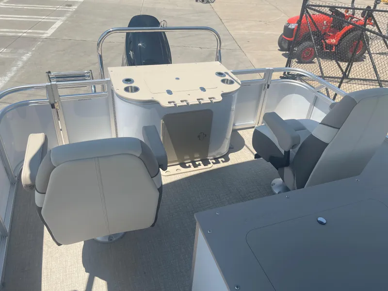 Slide: The Image of The image shows the rear of a 2024 Avalon LSZ Rear Fish pontoon boat with seating and a fishing station. - 21