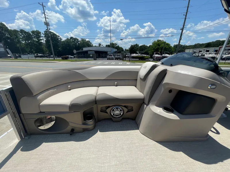 Slide: The Image of The image shows the cockpit of a 2024 Avalon LSZ Rear Fish with beige seating and speakers. - 33