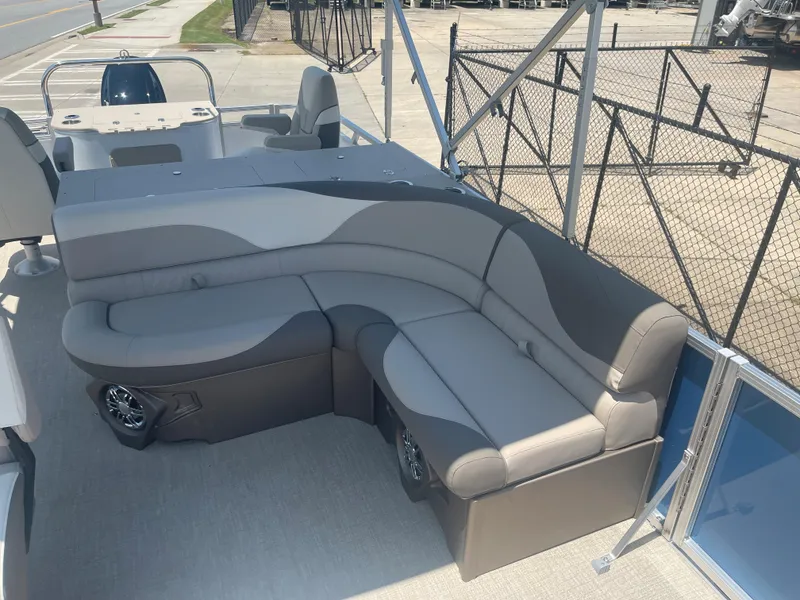 Slide: The Image of The image shows the seating area of a 2024 Avalon LSZ Rear Fish boat with gray upholstery. - 18