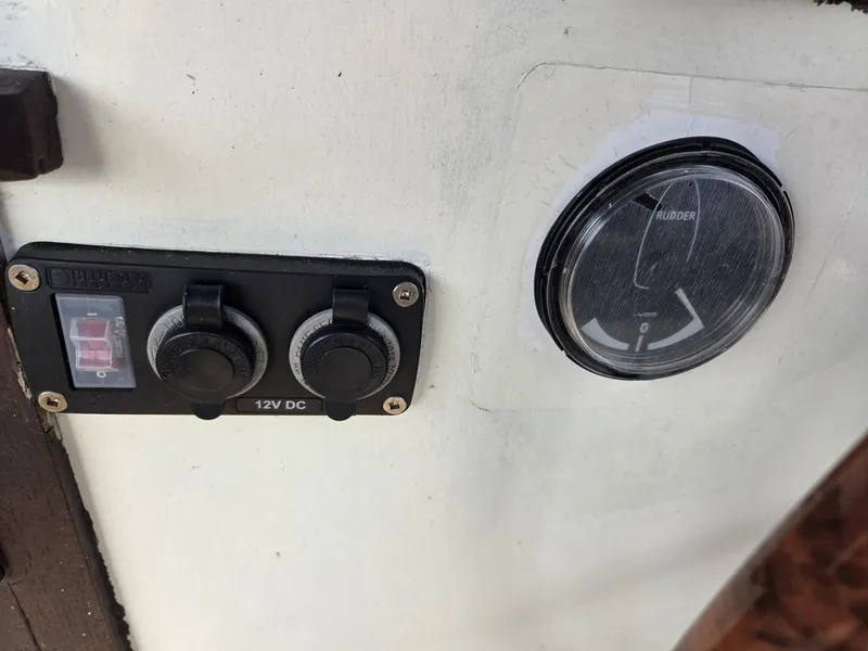 Slide: The Image of Close-up of a 12V DC switch and rudder meter on a boat. - 29