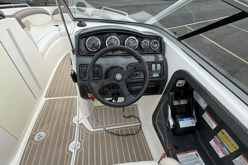Slide: The Image of 2008 Yamaha Boats AR230 HO dashboard with steering wheel and control panel. - 12