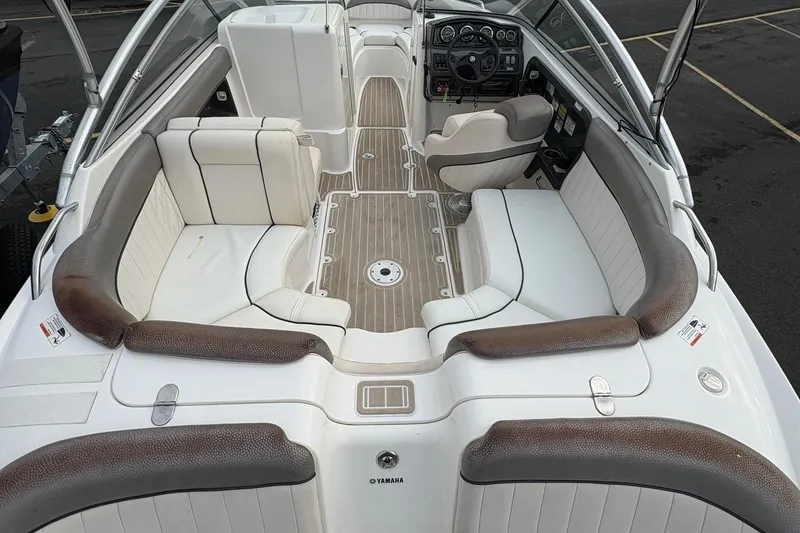Slide: The Image of 2008 Yamaha Boats AR230 HO interior with white seating and sleek dashboard design. - 7