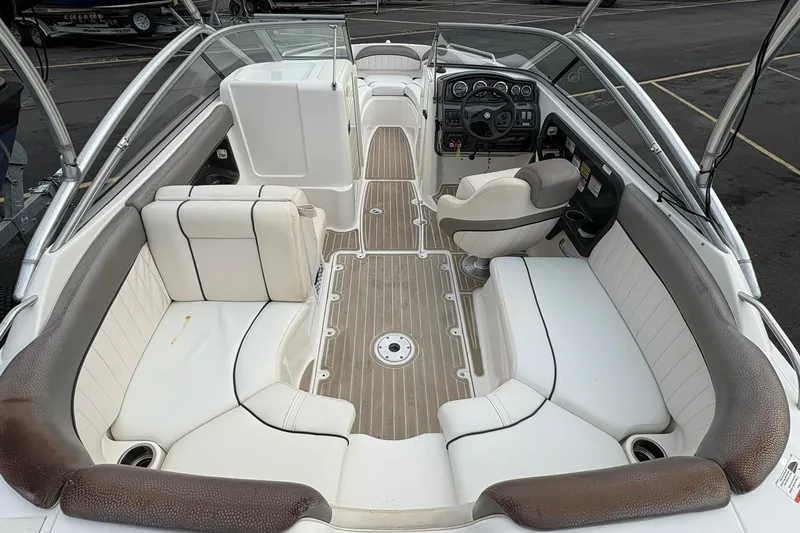 Slide: The Image of 2008 Yamaha Boats AR230 HO interior with white seating and modern dashboard. - 6