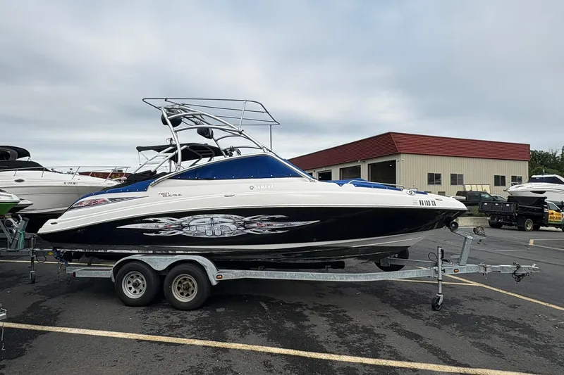 The Image of 2008 Yamaha Boats AR230 HO on trailer in parking lot, side view. - 0