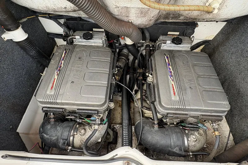 Slide: The Image of Twin engines of a 2008 Yamaha Boats AR230 HO, showcasing detailed mechanical components. - 14