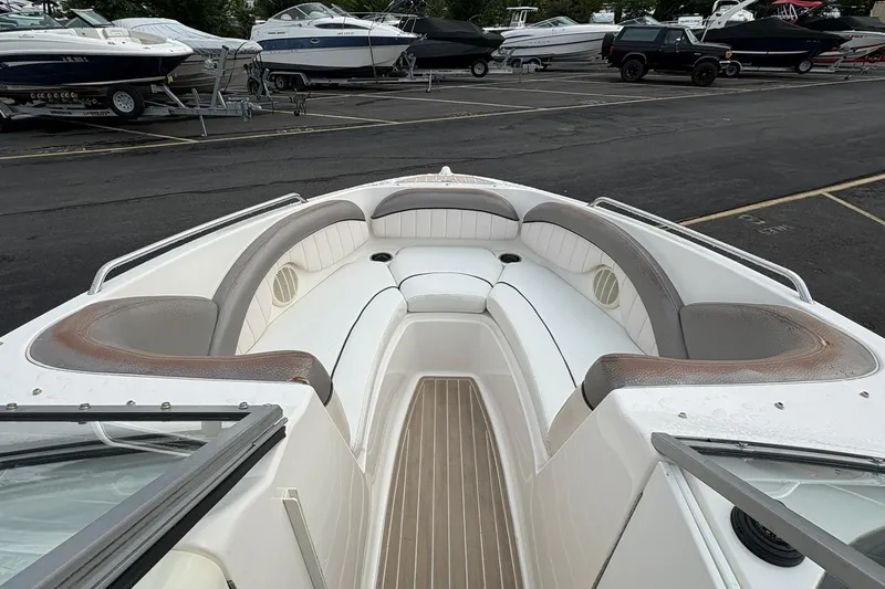 Slide: The Image of 2008 Yamaha Boats AR230 HO bow seating area in a marina setting. - 8