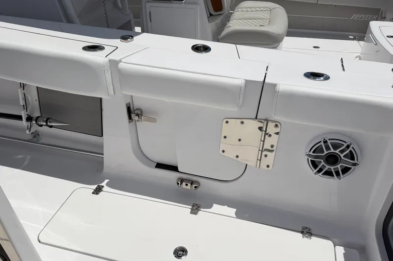 Slide: The Image of 2025 Sportsman Open 322 Center Console boat interior with seating and storage compartments. - 12
