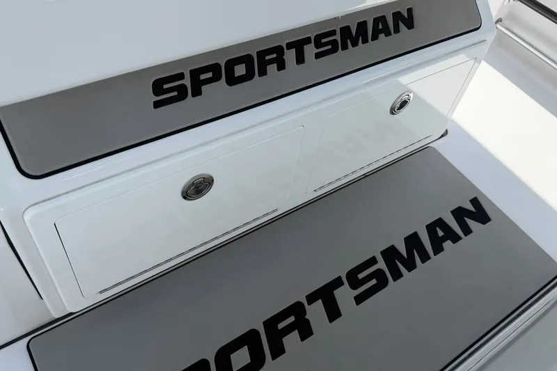 Slide: The Image of 2025 Sportsman Open 322 Center Console boat deck with storage compartments. - 11