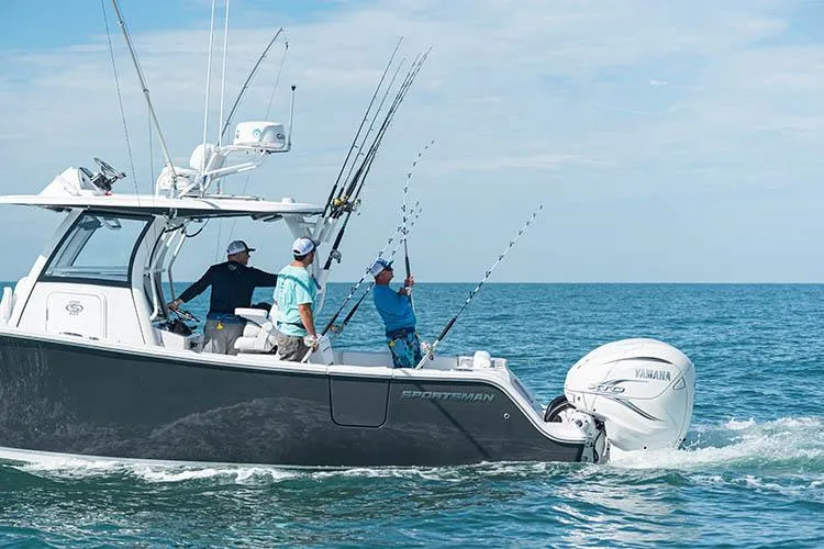 Slide: The Image of Manufacturer Provided Image: 2025 Sportsman Open 322 Center Console boat with anglers fishing at sea. - 14