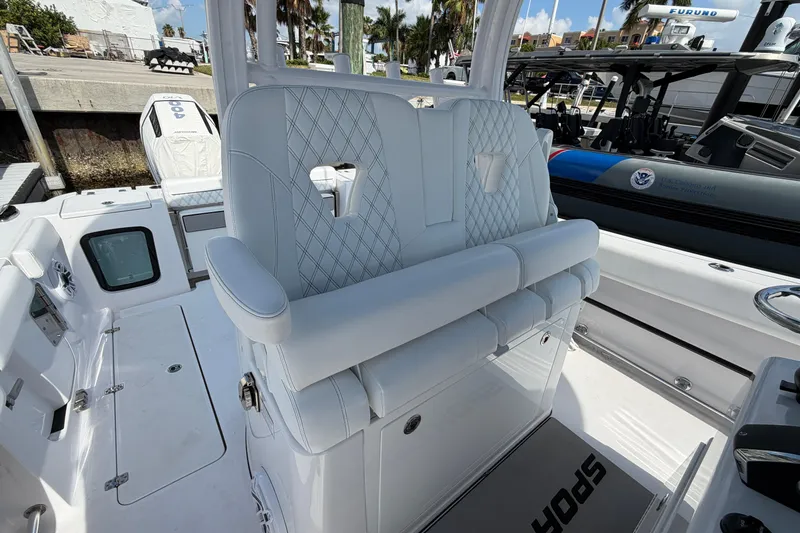 Slide: The Image of 2025 Sportsman Open 322 Center Console boat interior with luxurious seating and modern design. - 4
