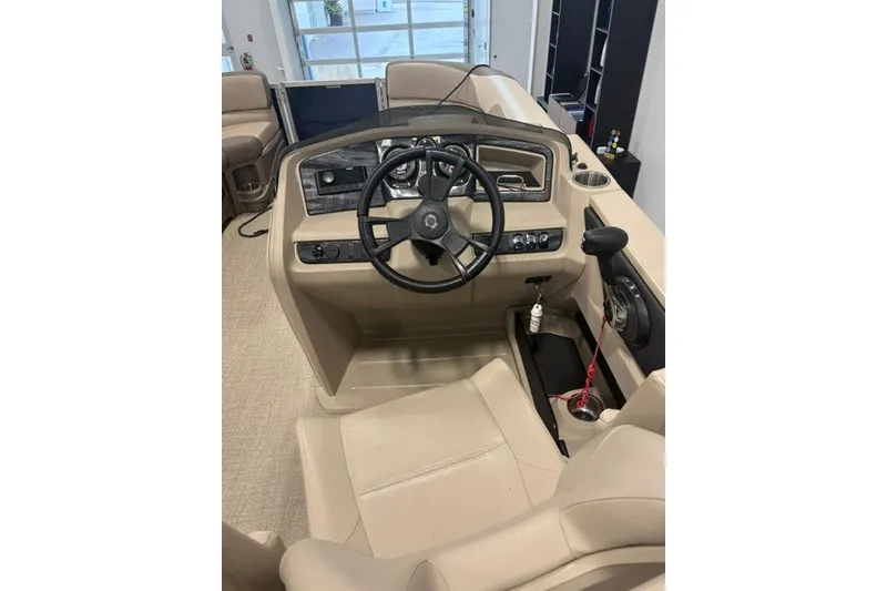 Slide: The Image of 2022 Avalon LSZ 2285 CR boat interior with steering wheel and control panel. - 9