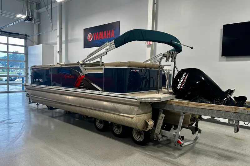 Slide: The Image of 2022 Avalon LSZ 2285 CR pontoon boat with Mercury engine in showroom. - 11