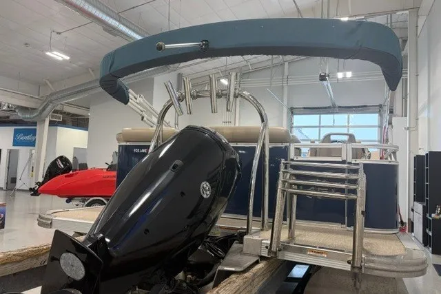 Slide: The Image of 2022 Avalon LSZ 2285 CR pontoon boat with outboard motor in showroom. - 8
