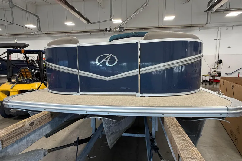 Slide: The Image of 2022 Avalon LSZ 2285 CR pontoon boat in a warehouse setting. - 4