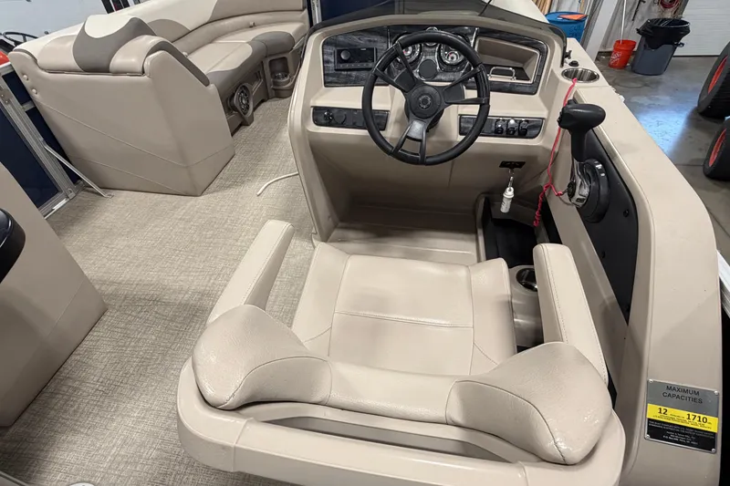 Slide: The Image of 2022 Avalon LSZ 2285 CR boat interior with steering console and seating. - 11