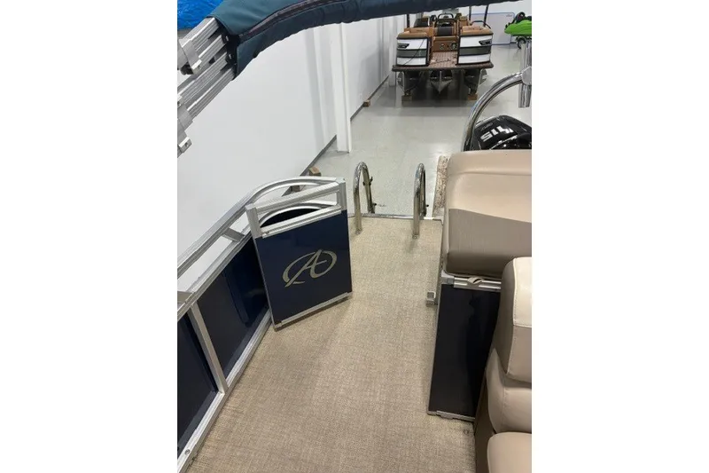 Slide: The Image of 2022 Avalon LSZ 2285 CR pontoon boat interior with seating and railing details. - 10