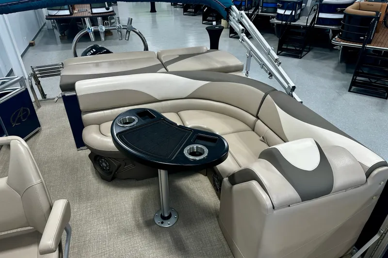 Slide: The Image of Luxurious 2022 Avalon LSZ 2285 CR pontoon boat interior with plush seating and table. - 15