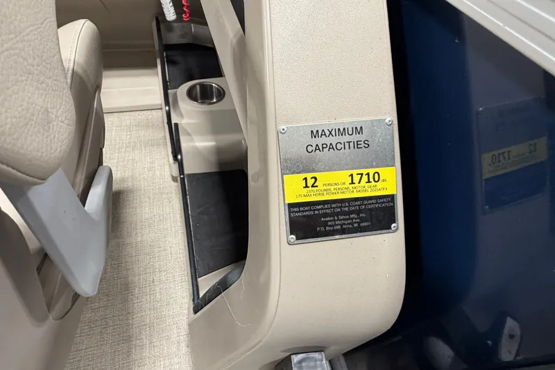 Slide: The Image of 2022 Avalon LSZ 2285 CR boat capacity label, seating for 12, maximum weight 1710 lbs. - 12