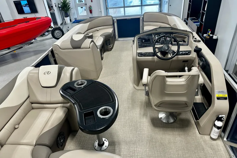 Slide: The Image of Interior of 2022 Avalon LSZ 2285 CR pontoon boat with beige seating and steering console. - 21