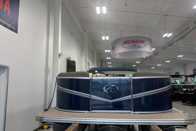 Slide: The Image of 2022 Avalon LSZ 2285 CR pontoon boat displayed in a showroom. - 5