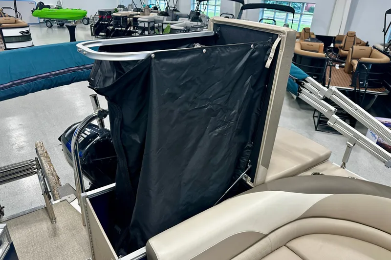 Slide: The Image of 2022 Avalon LSZ 2285 CR pontoon boat interior with seating and privacy curtain. - 19