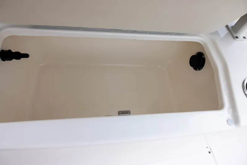Slide: The Image of Interior view of a storage compartment on a 2022 Bayliner T22CX boat. - 16