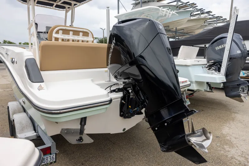 Slide: The Image of The image shows a 2022 Bayliner T22CX boat with a powerful outboard motor. - 4
