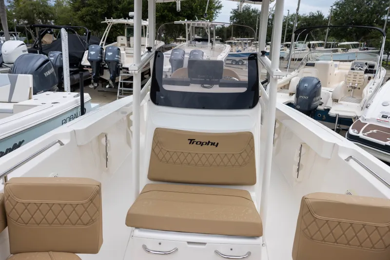 Slide: The Image of The image shows a 2022 Bayliner T22CX boat with beige seating and a clear cockpit. - 12