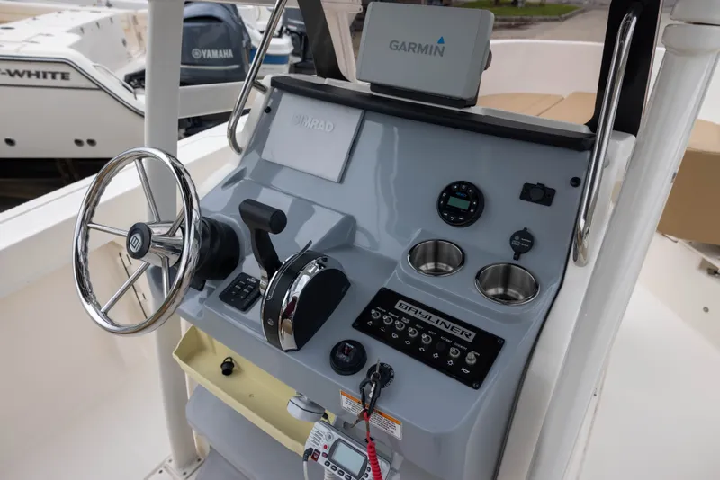 Slide: The Image of The image shows the helm of a 2022 Bayliner T22CX with Garmin navigation. - 7