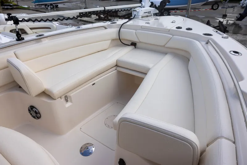 Slide: The Image of The 2021 Grady-White Canyon 271 features a spacious, cushioned seating area at the bow. - 14