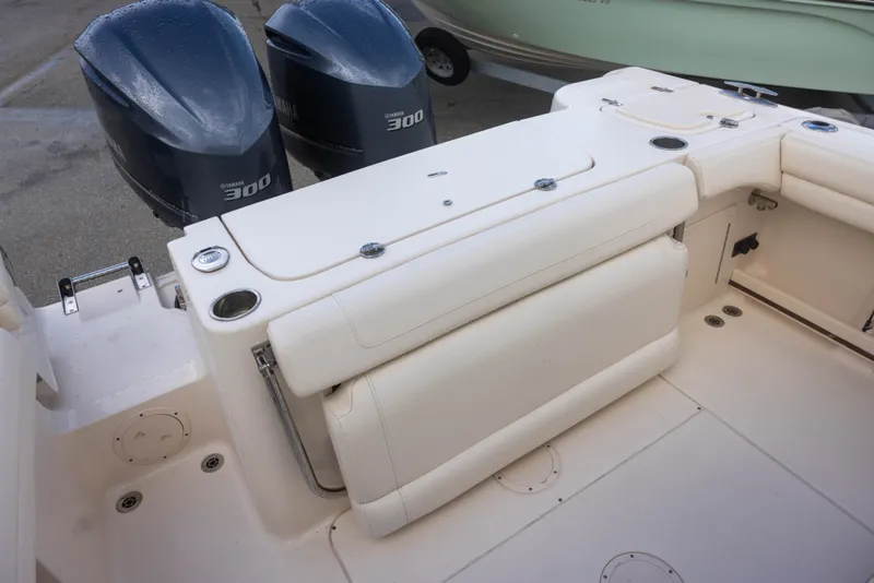 Slide: The Image of The image shows the cockpit of a Grady-White Canyon 271 with two outboard engines. - 6