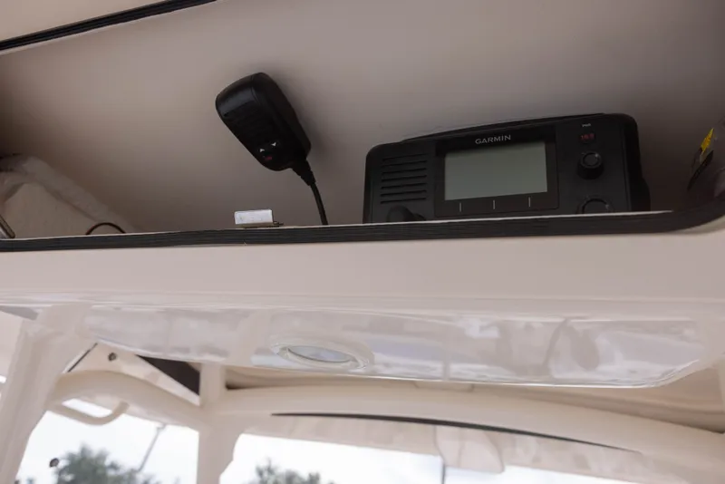 Slide: The Image of A Garmin device is mounted on a shelf in a Grady-White Canyon 271 boat. - 13