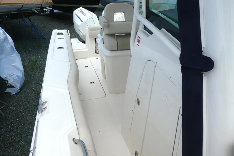 Slide: The Image of 2027 Boston Whaler 250 Outrage boat interior, showcasing seating and deck details. - 15