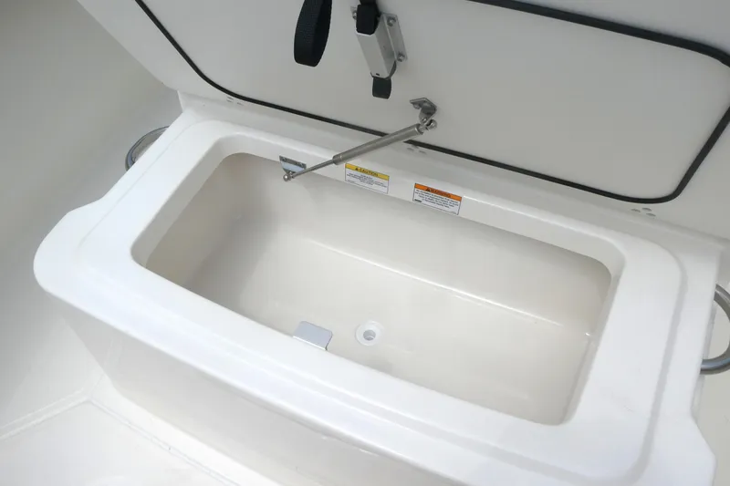 Slide: The Image of Open storage compartment on 2027 Boston Whaler 250 Outrage boat. - 12