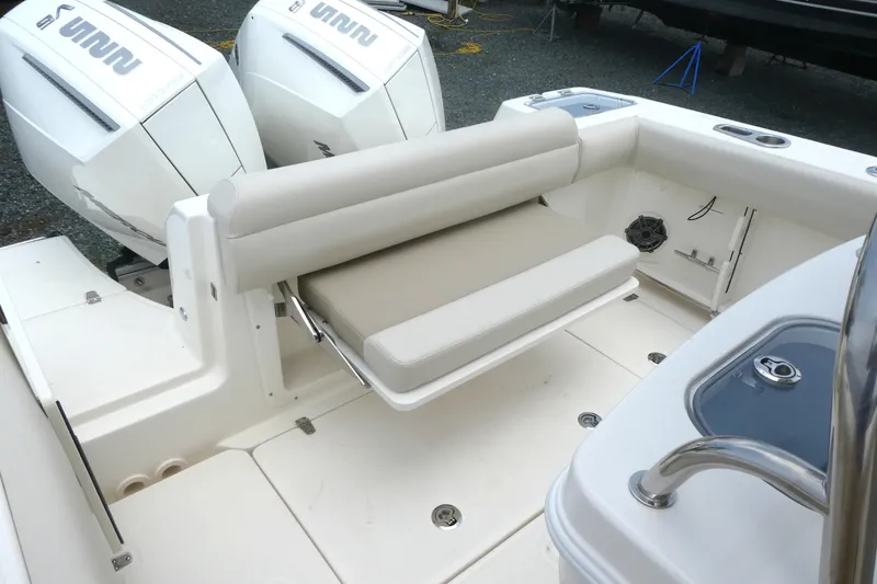 Slide: The Image of 2027 Boston Whaler 250 Outrage boat with dual engines and cushioned seating. - 7