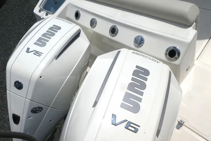 Slide: The Image of 2027 Boston Whaler 250 Outrage with dual Mercury V6 engines, showcasing sleek design. - 4