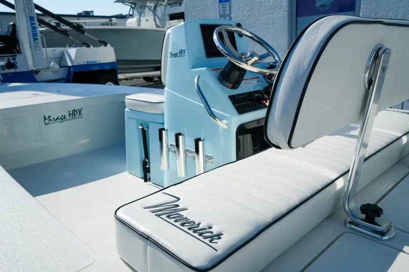Slide: The Image of 2027 Maverick Mirage 18 HPX-V boat interior with steering console and seating. - 14