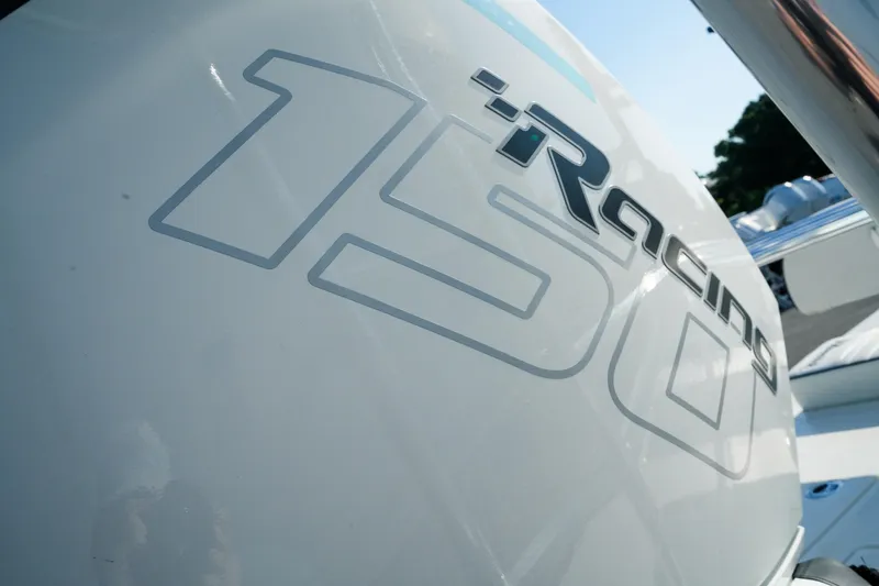 Slide: The Image of Close-up of 2027 Maverick Mirage 18 HPX-V boat engine with "iRacing 150" decal. - 8