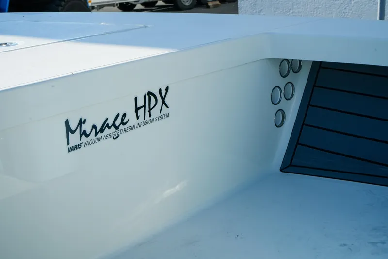 Slide: The Image of 2027 Maverick Mirage 18 HPX-V boat with VARIS technology, white hull detail. - 19